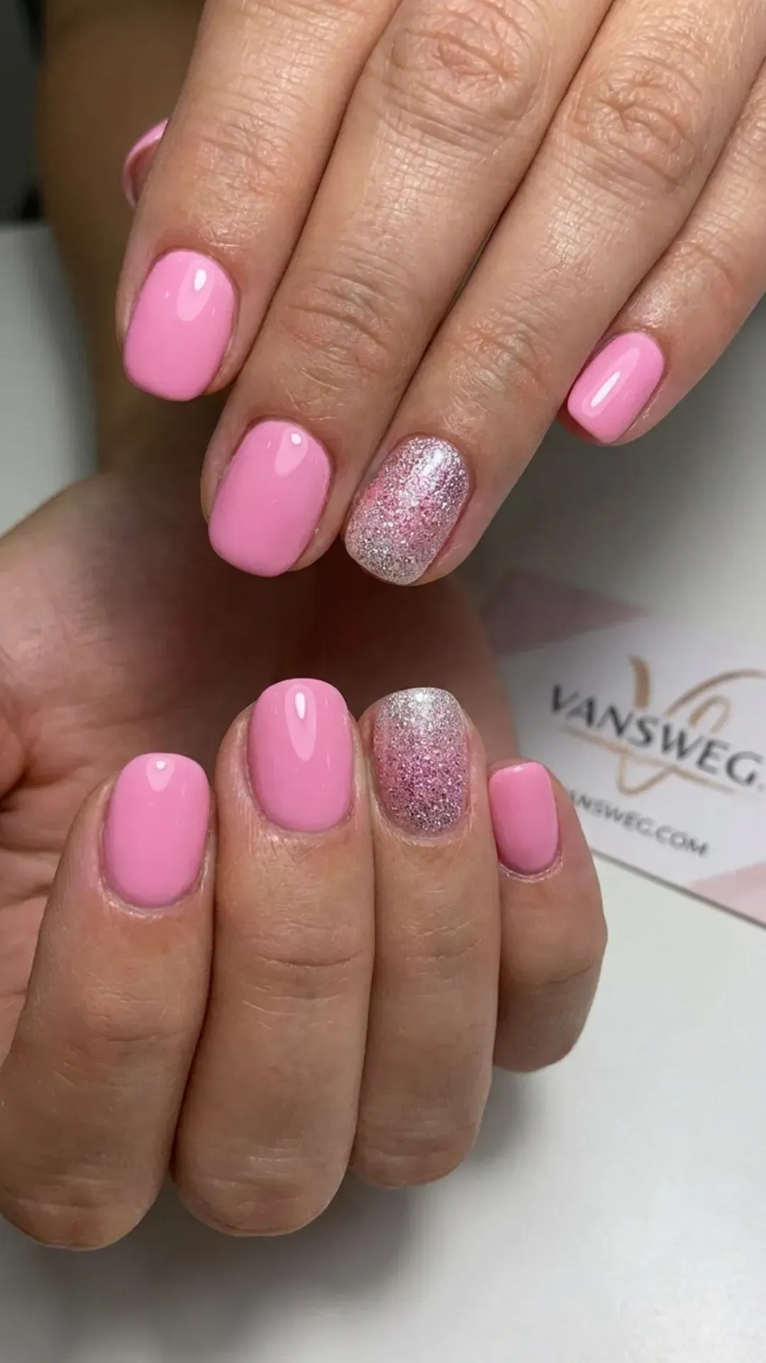 Short bubblegum pink natural nails with a fine silver and pink glitter gradient accent nail by VANSWEG.COM.