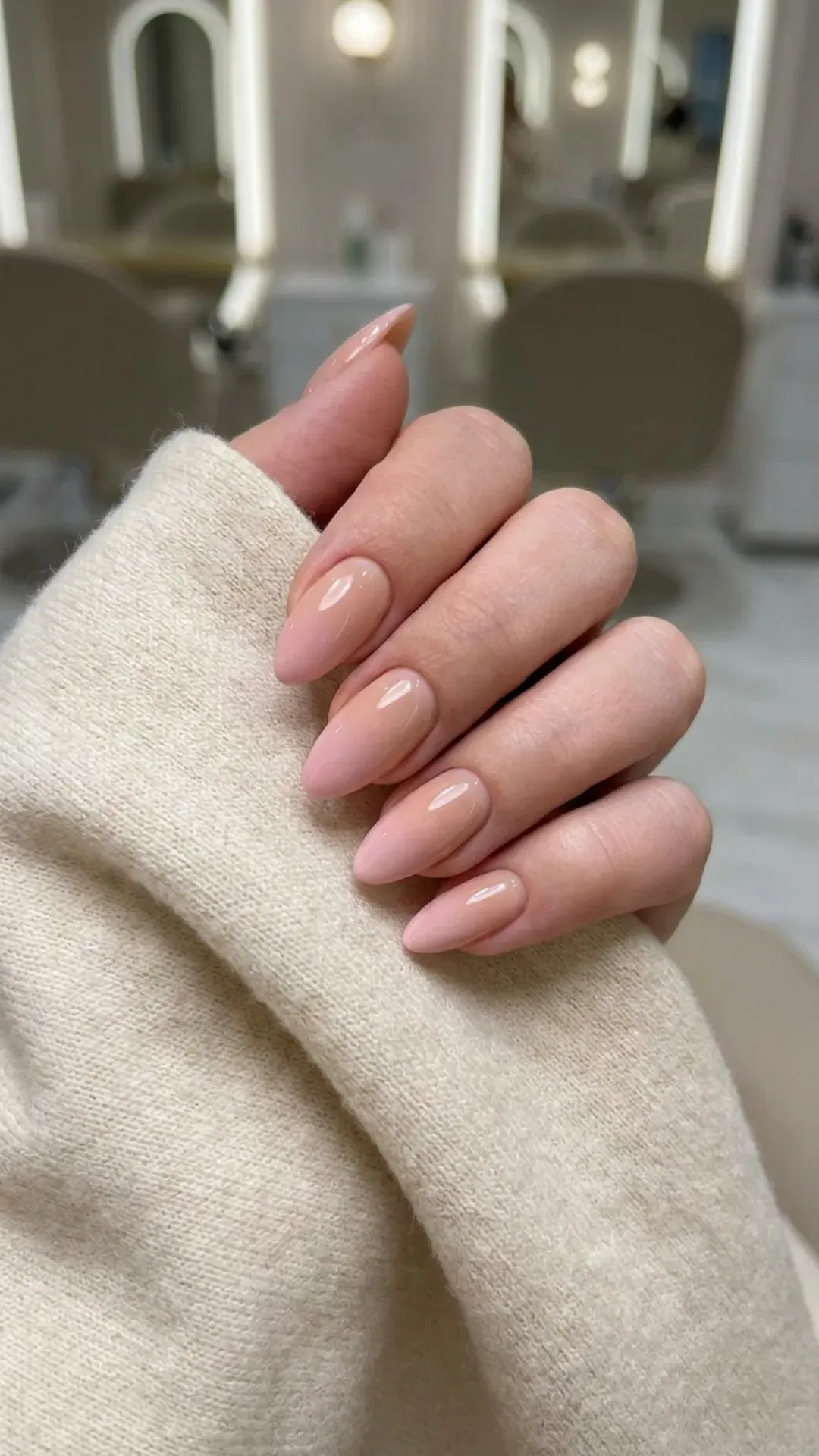 Elegant nude to pink ombre nails with a smooth gradient, ideal for a sophisticated and modern manicure style.