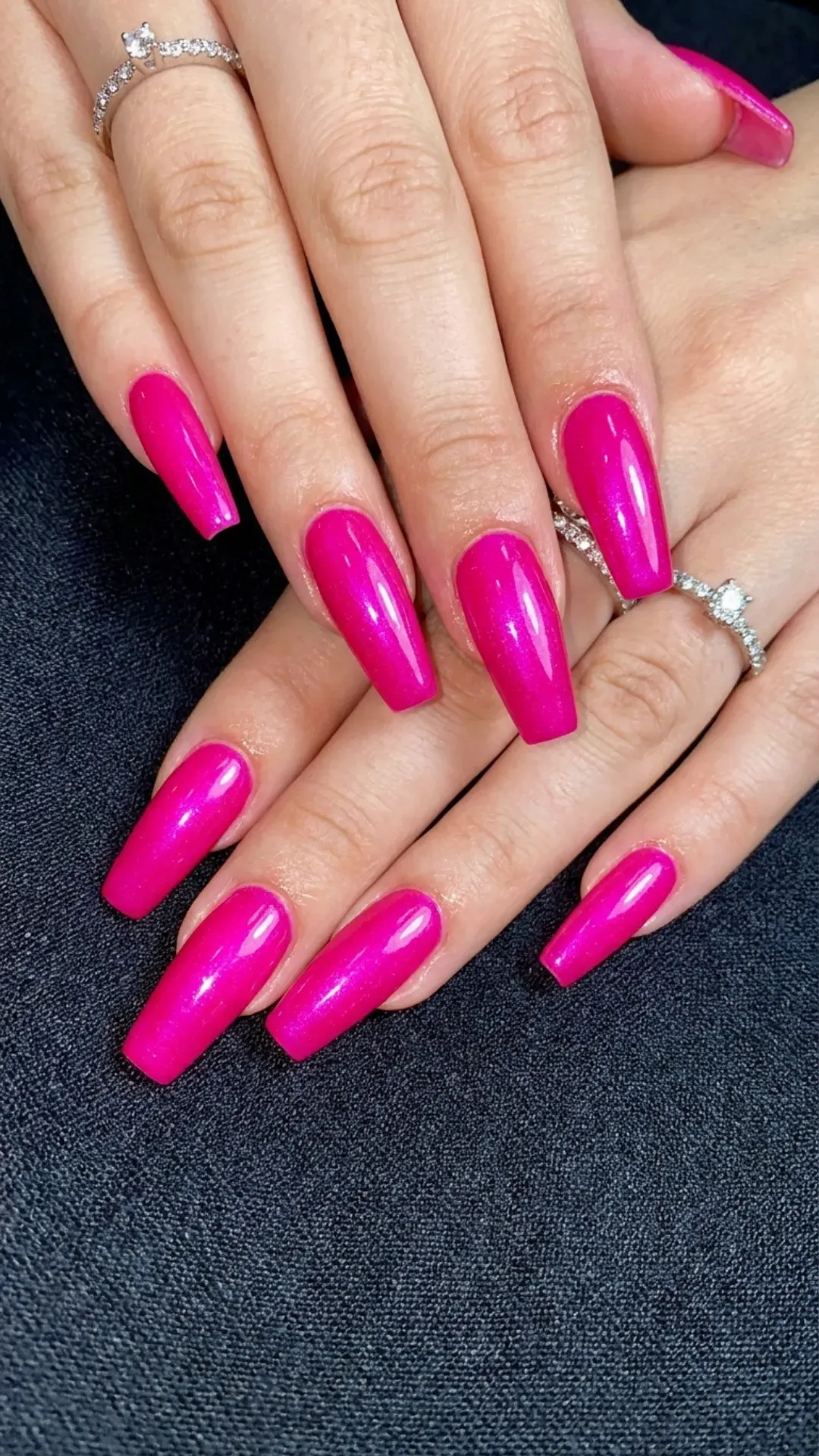 Striking coffin nails featuring a vibrant fuchsia polish that radiates confidence and adds a bold flair to any outfit or occasion.
