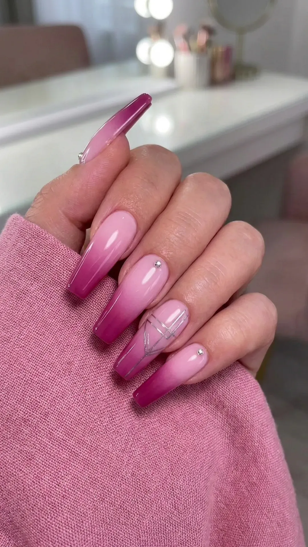 Stylish gradient coffin nails transitioning from a soft baby pink to a rich magenta, adding a unique and modern touch to the classic pink nail design.