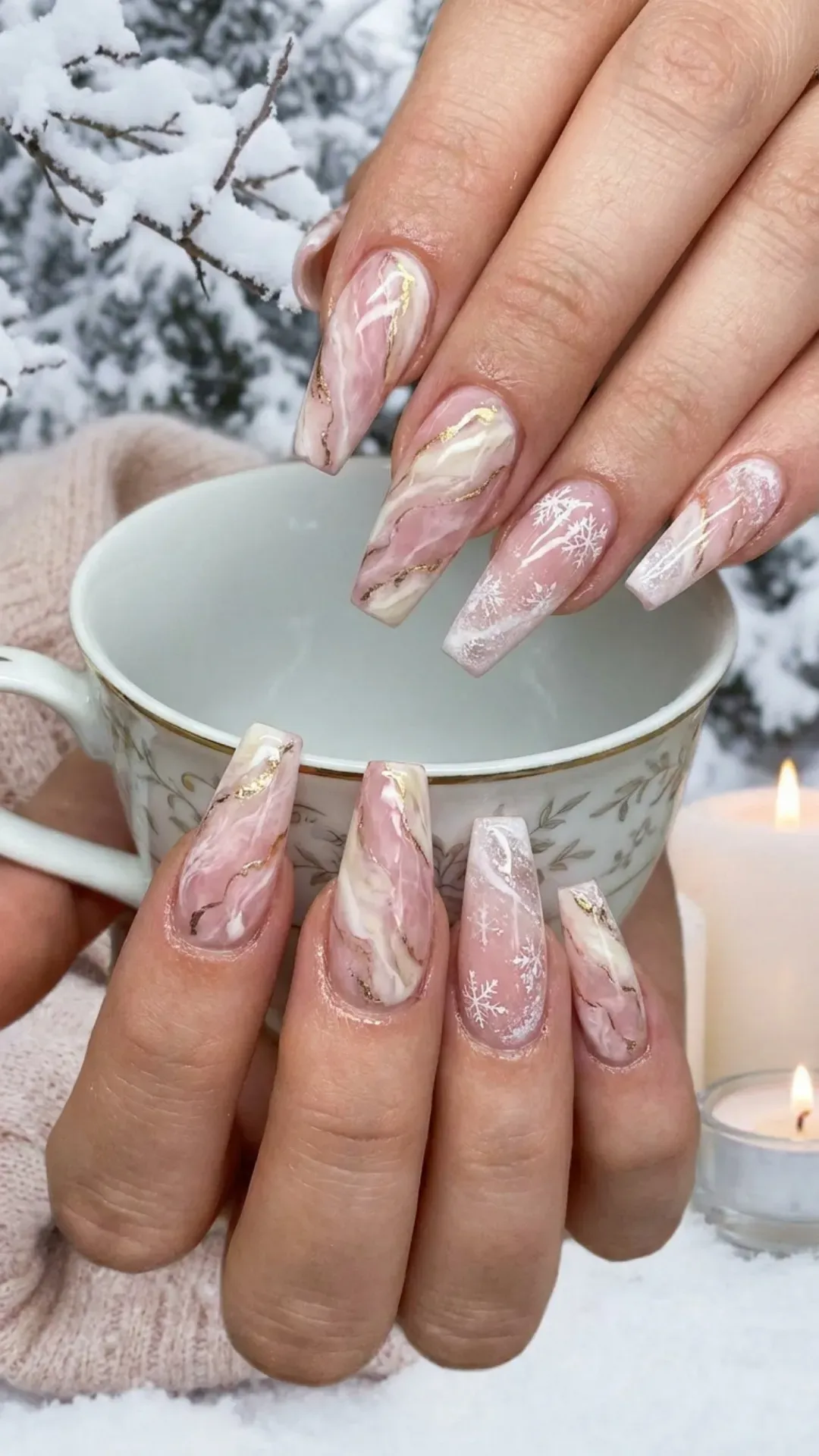 Elegant coffin-shaped nails showcasing a luxurious pink and white marble effect, with swirling patterns that mimic natural stone, perfect for a refined and graceful winter nail aesthetic.