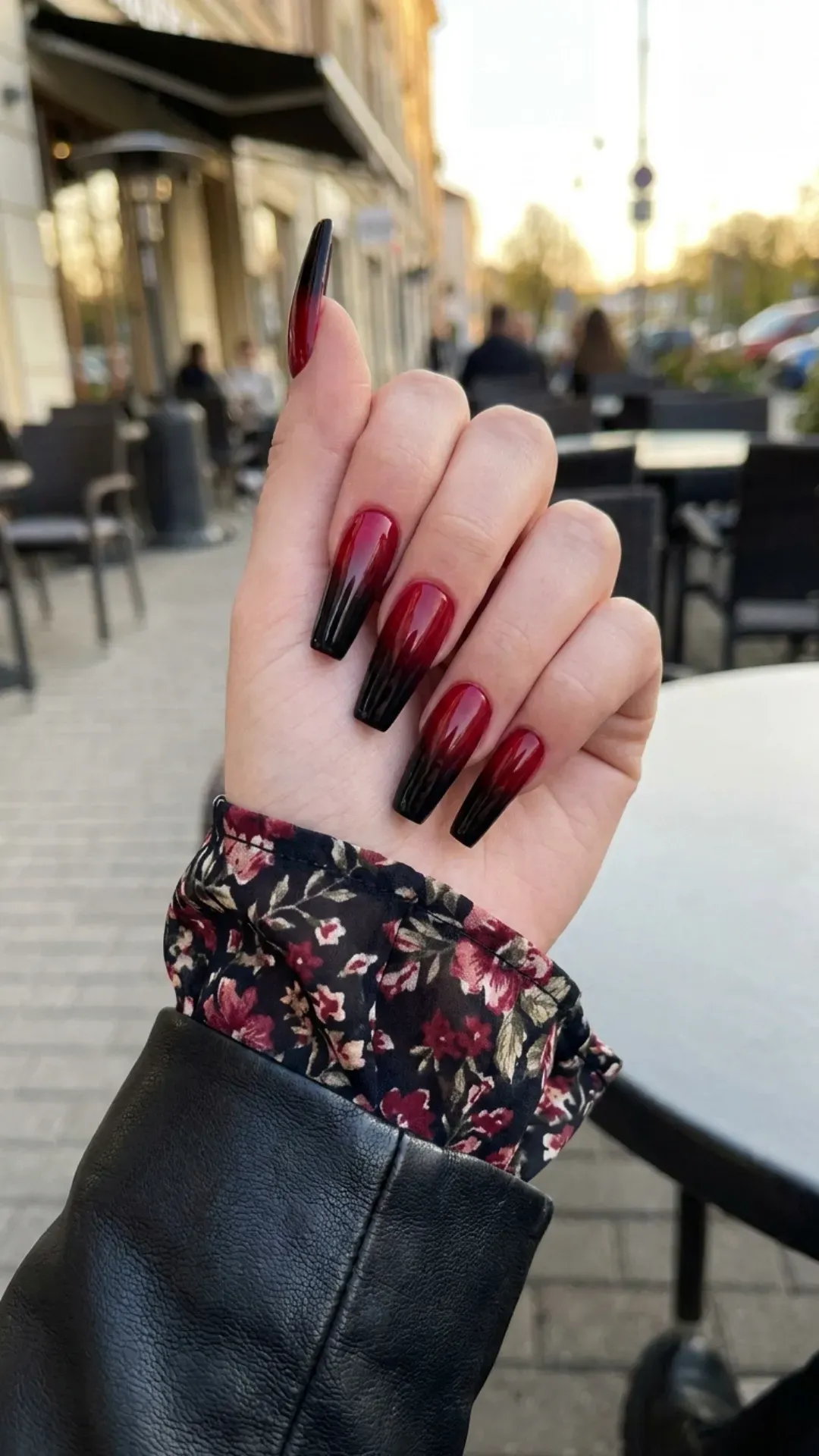 Dramatic coffin nails with a bold red and black ombre effect, presenting a striking and edgy nail art choice that adds a touch of daring to any spring ensemble