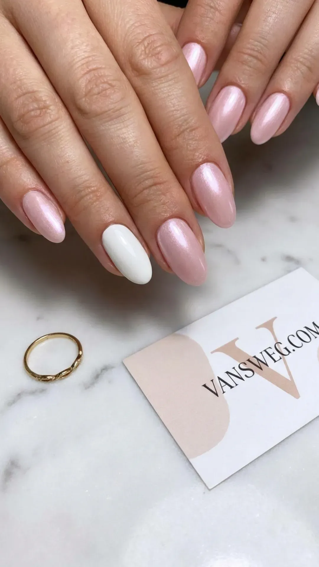 Soft pink pearl shimmer finish oval nails with an elegant solid opaque white accent nail by VANSWEG.COM.