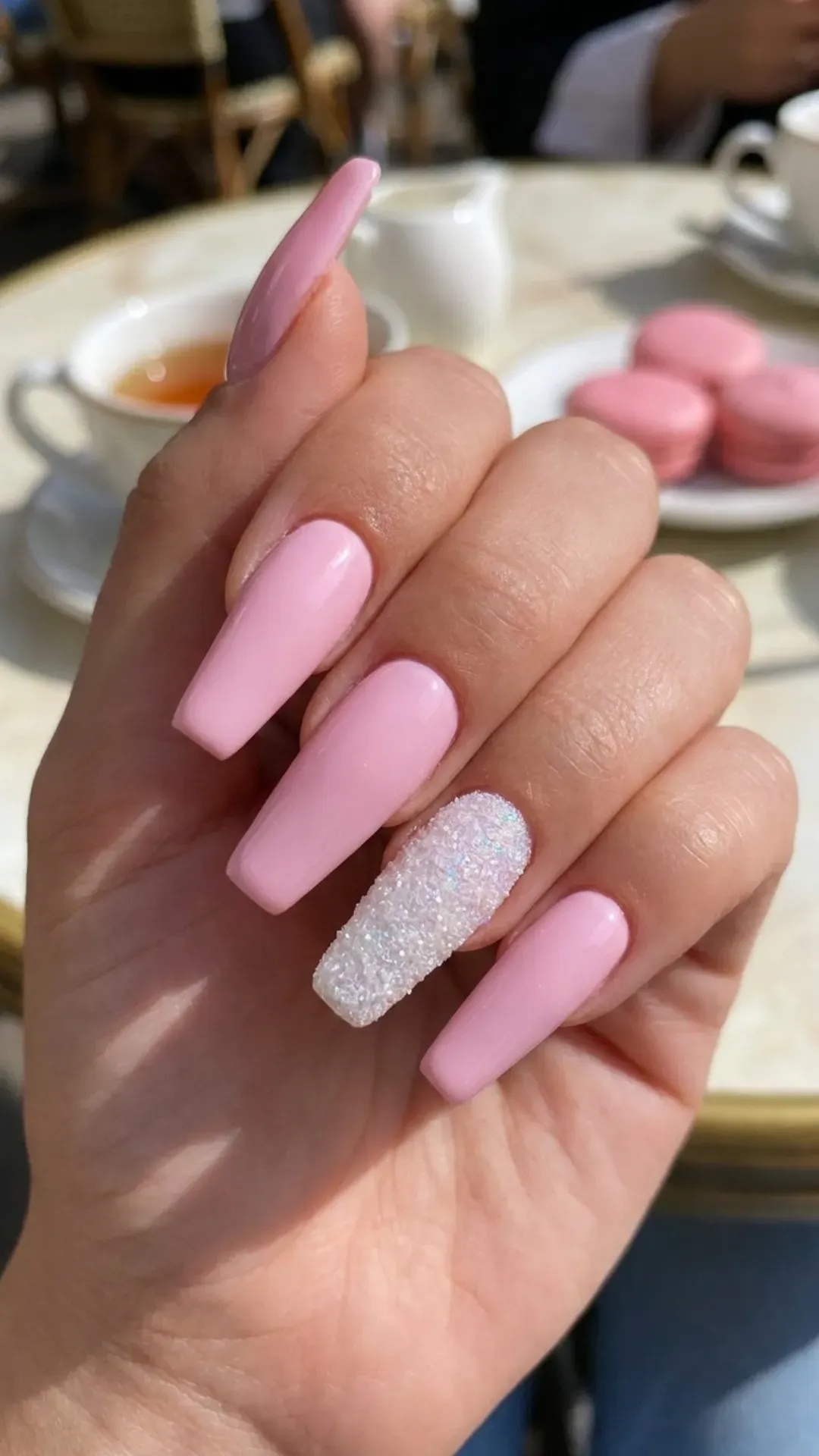 A delightful combination of sweet pink base nails with one accent nail featuring a sugary frost finish, perfect for a playful and feminine look.