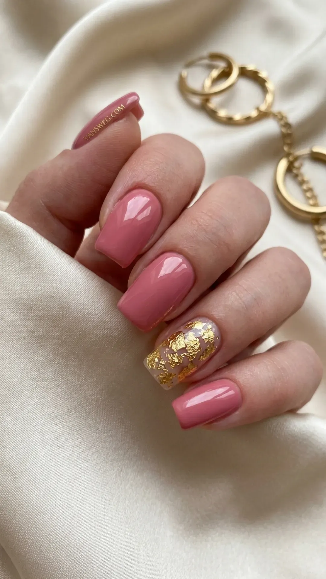 Medium square rose pink nails paired with a luxurious textured gold foil flake accent nail by VANSWEG.COM.