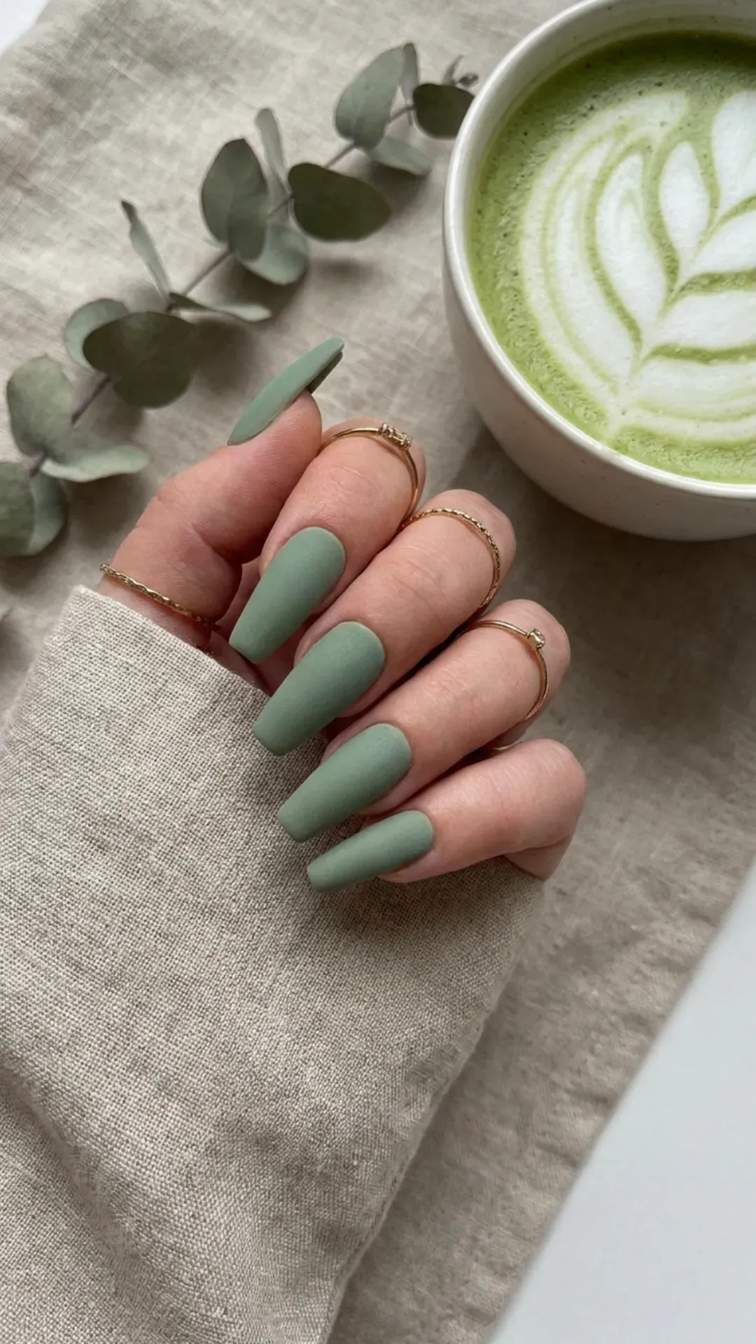 Trendy matte sage green coffin nails, presenting a muted yet modern color choice with a velvety finish that's a versatile addition to any spring fashion palette