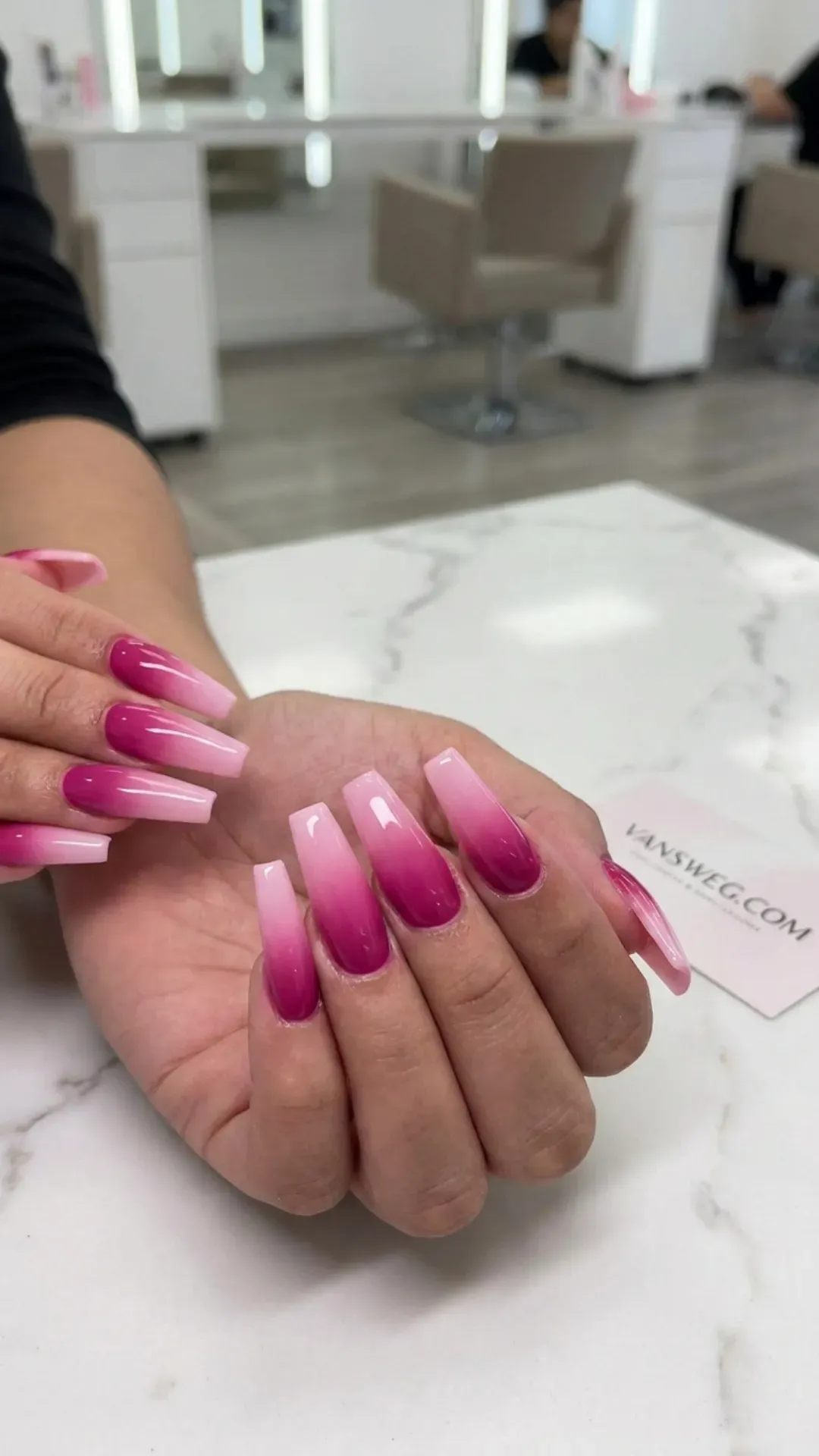 Long tapered square nails showcasing a flawless, modern fuchsia-to-baby-pink gradient fade design by VANSWEG.COM.