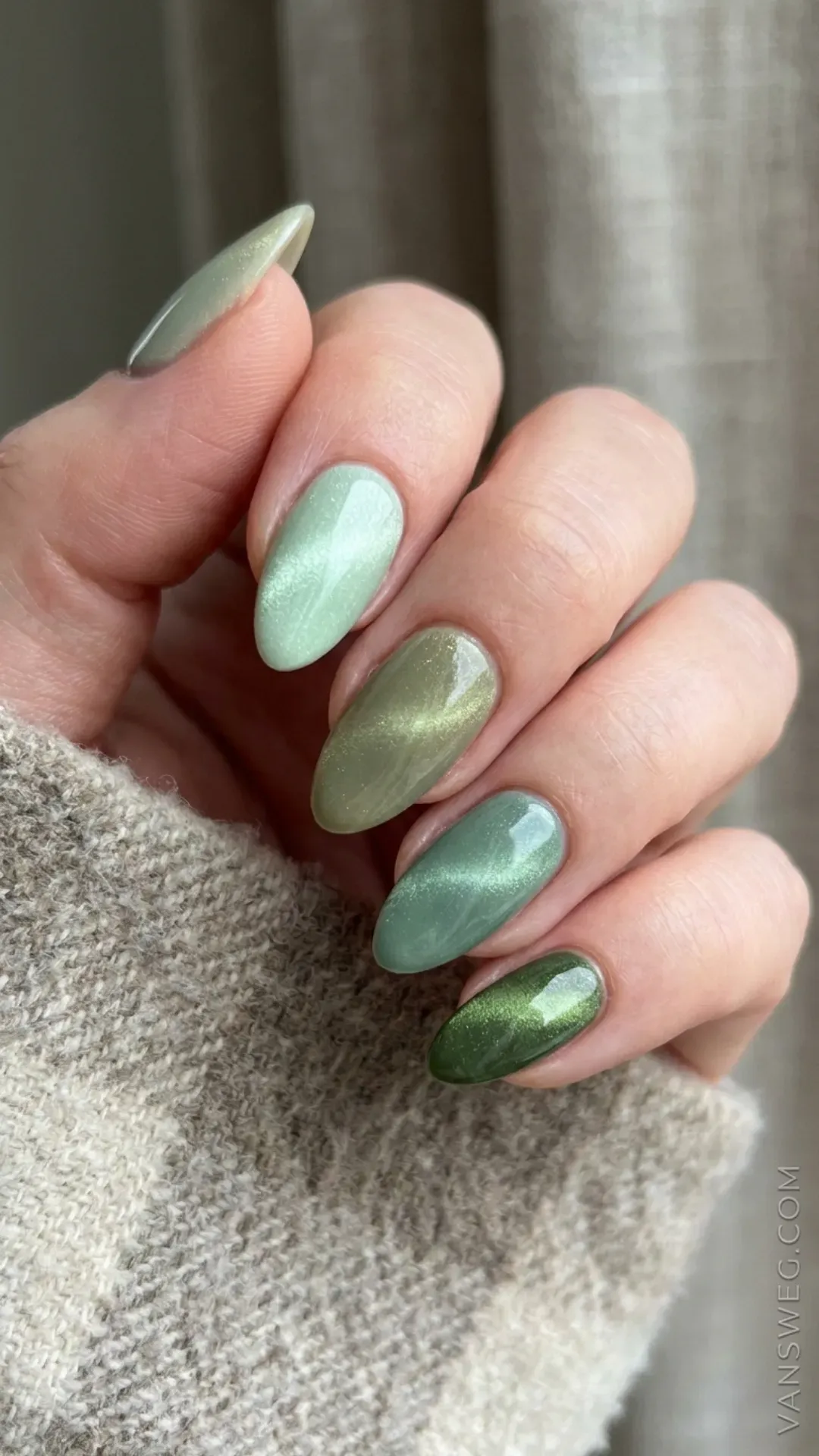 gradient skittle manicure featuring different shades of green magnetic cat-eye polish by VANSWEG.COM