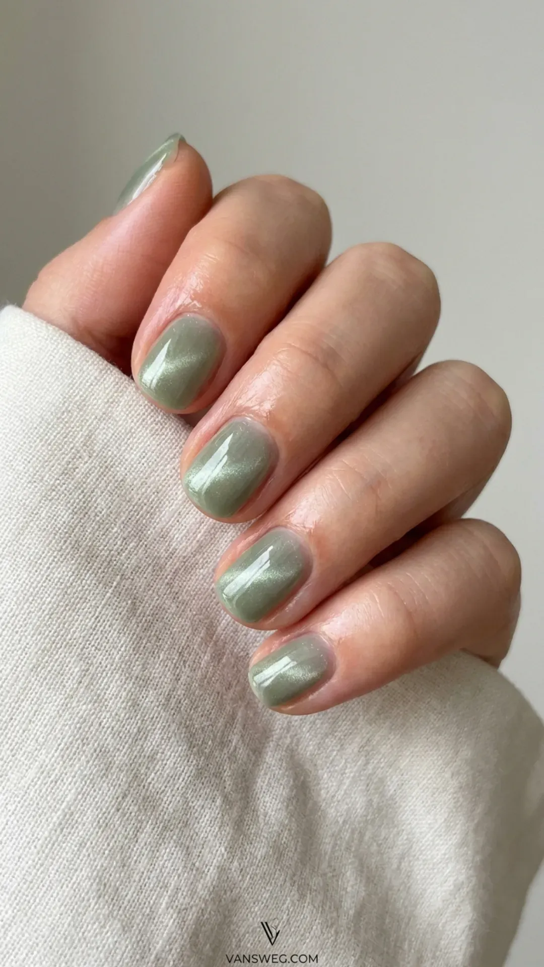 sheer and natural short nails with a subtle sage green magnetic cat-eye glow by VANSWEG.COM