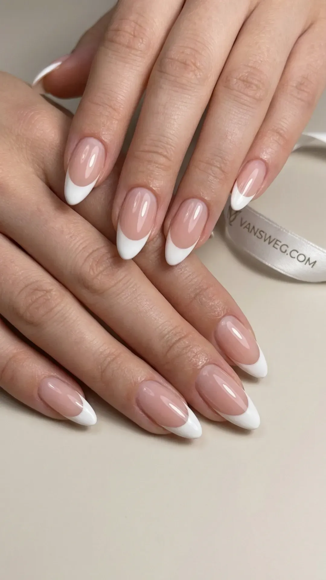 classic white french tip on almond shaped nails by VANSWEG.COM