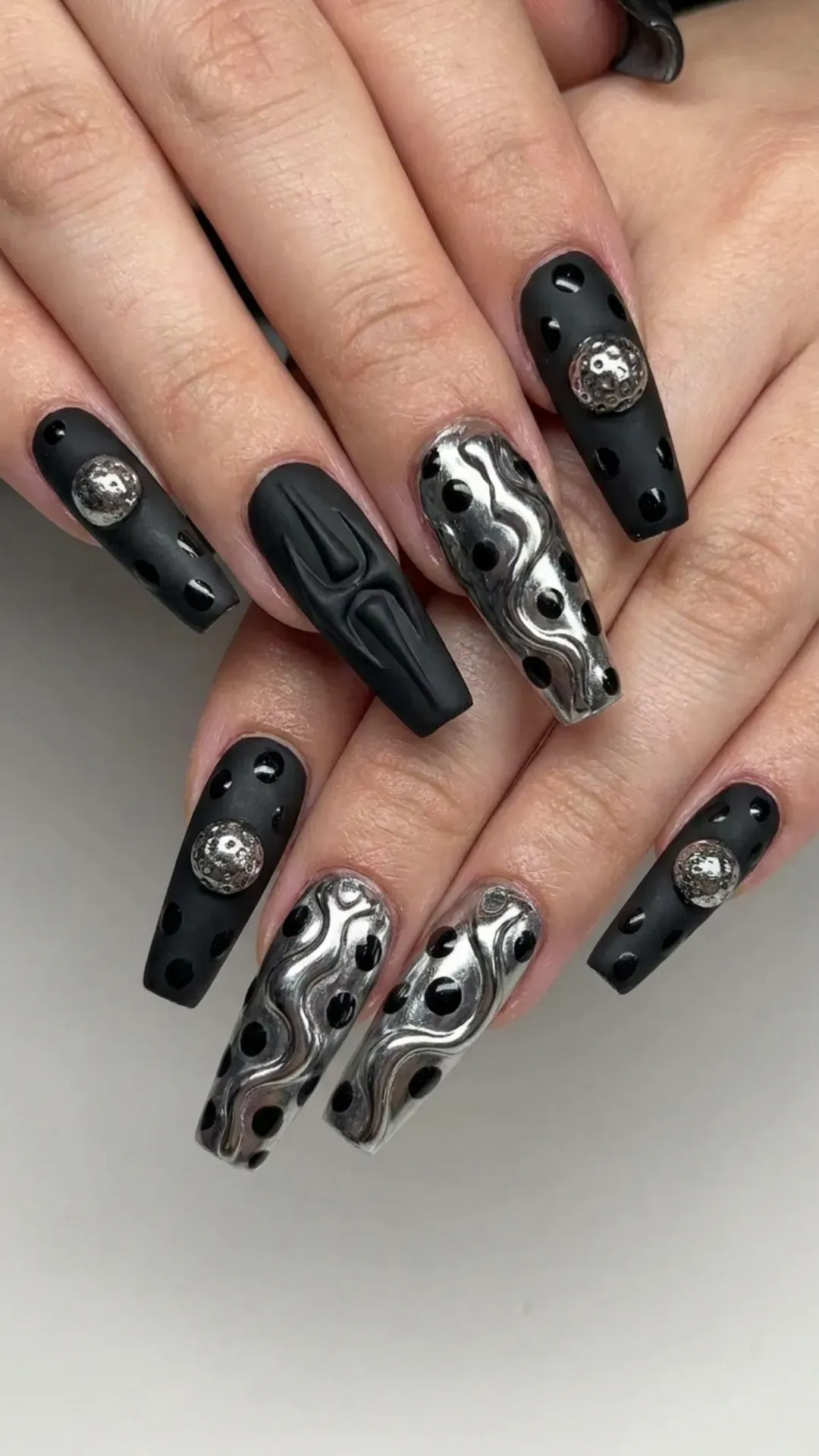 Edgy 3D Abstract Nail Art - Black and silver 3D nail art with sculpted textures and polka dots