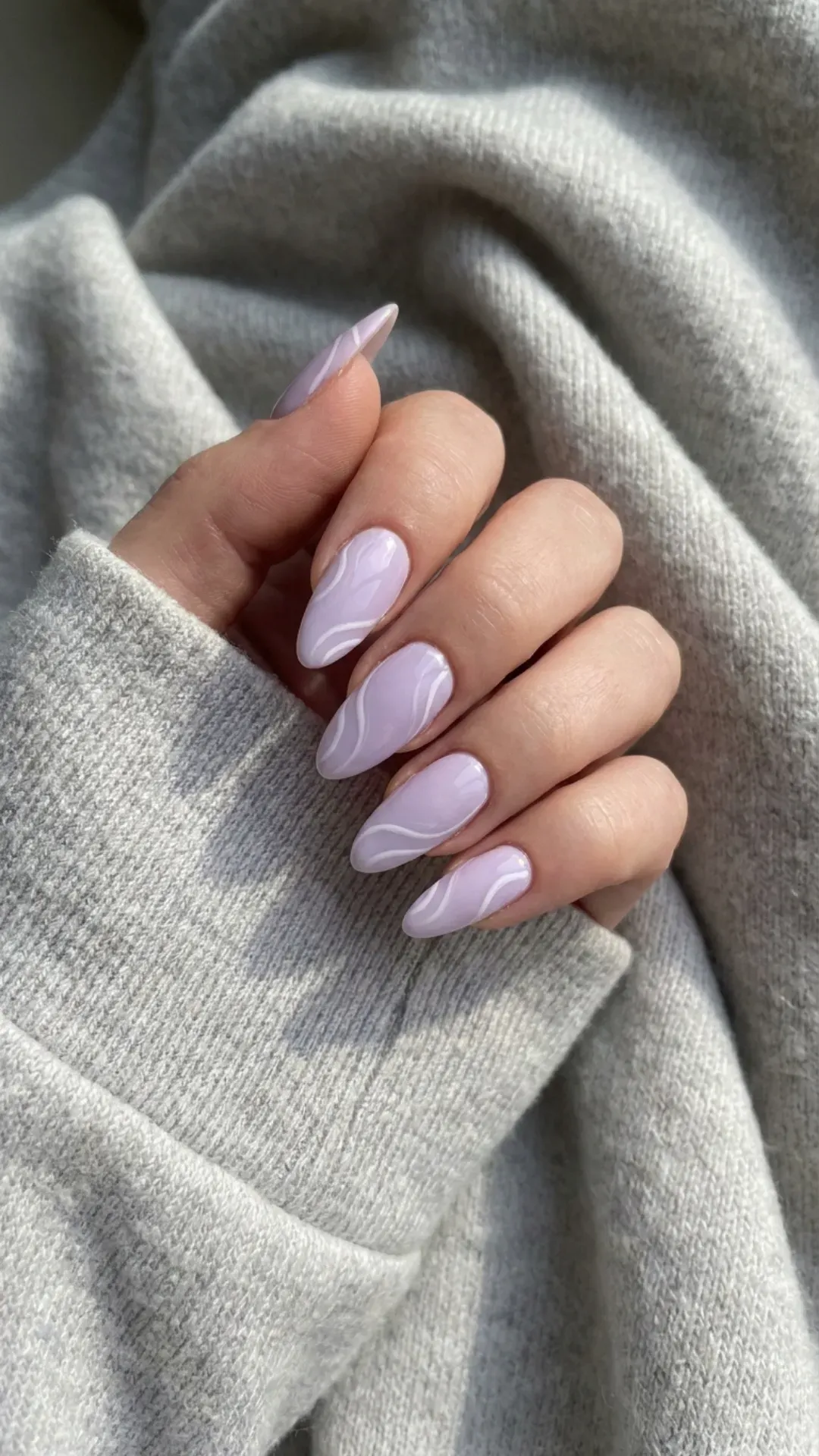 Light Purple Swirl Nails - Pale purple nails with soft white swirl designs and glossy finish