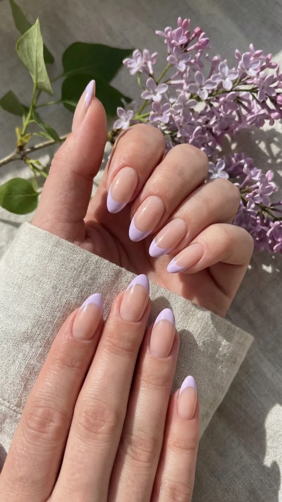 Lilac French Tip Nails - Nude nails with soft purple French tips for a fresh spring look
