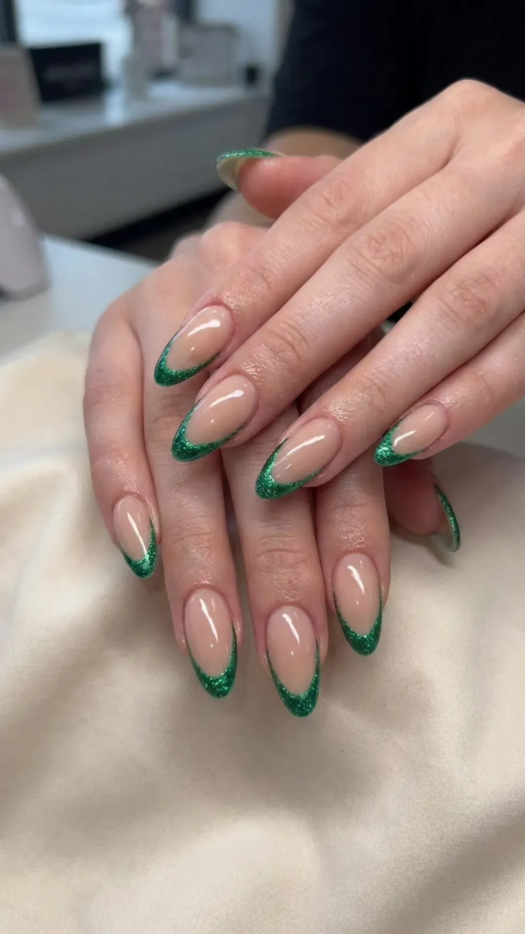 Green Glitter Frame French Tips - Nude nails with green glitter outlines forming a bold frame look