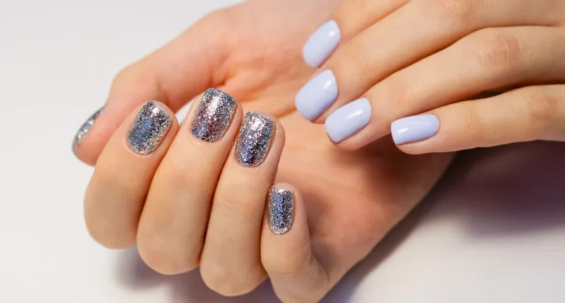 Smooth lavender nails with a dazzling coarse glitter finish, providing a subtle yet captivating look for welcoming the New Year with style.