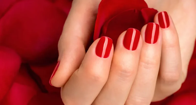 Timeless deep red nails with a glossy finish, embodying the quintessential Valentine's Day color for a simple yet powerful statement of love.