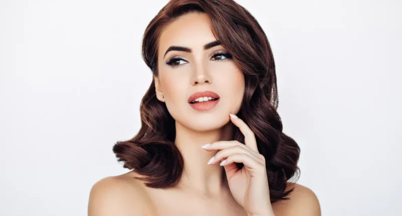 Glamorous and elegant vintage curls on a poised woman, her hair reminiscent of classic Hollywood, ideal for a timeless Valentine's Day celebration.