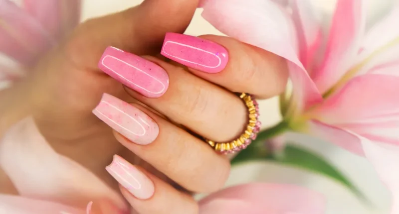 Glistening coffin nails featuring layers of shimmering pink shades with a jelly-like transparency, offering a playful and candy-inspired aesthetic for a fun spring vibe