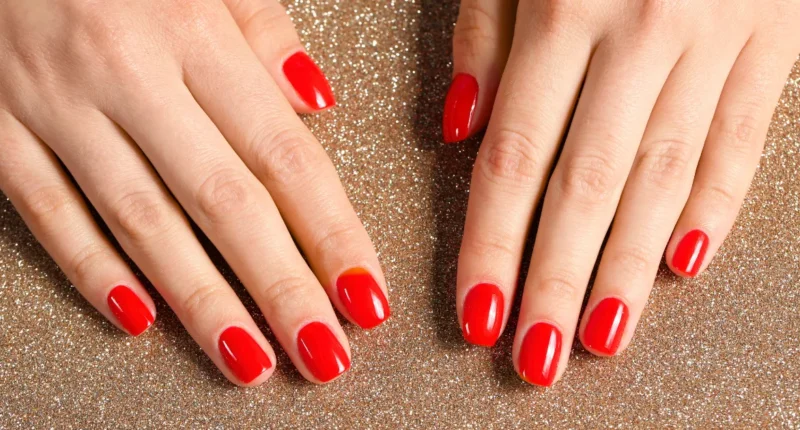 Classic, glossy red nails perfectly polished for a timeless Valentine's Day look, representing love and passion.